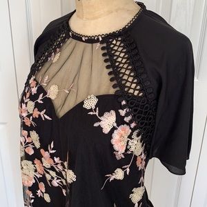 NWT Women’s Lipsey chiffon embroidered top. Black with floral design. Size 6.